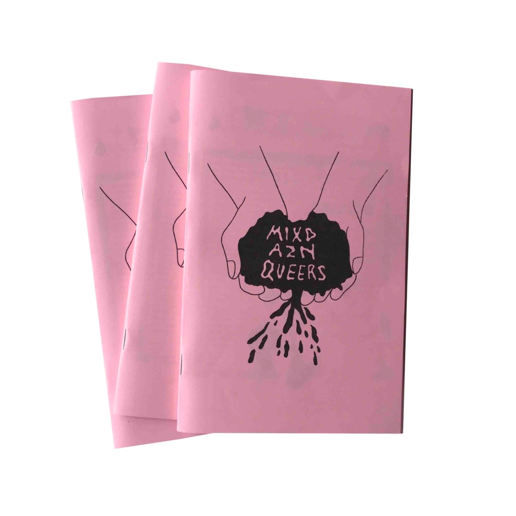 the title of mixd azn queers zine is printed with black ink on baby pink paper. The center shows wobby bubble letters of the zine titled, encompassed within a pool of liquid that is held within two scopped hands, there are droplets of liquid escaping down beneath.